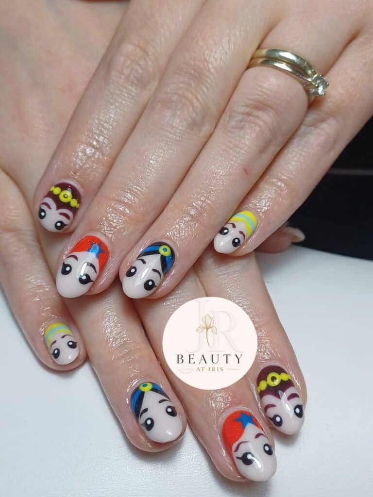 Hands with colourful cartoon character nail art