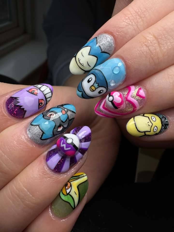 Pokémon character nail art with glitter and Poké Balls