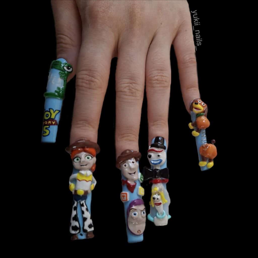 Toy Story character-themed 3D nail art on a hand