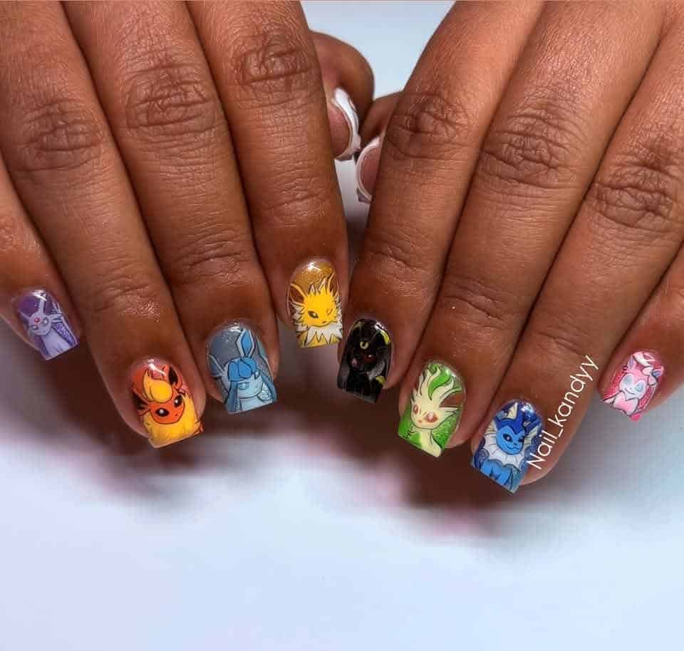 Hands with colourful Pokémon character nail art