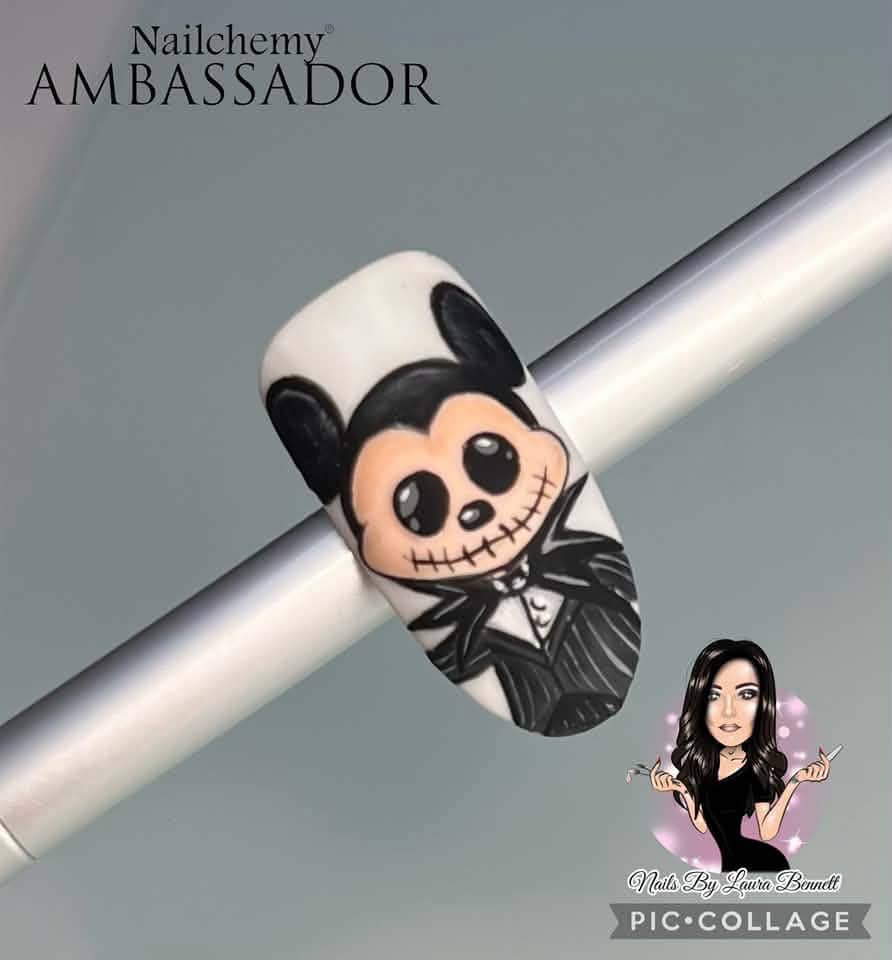 Halloween-inspired Mickey Mouse and skeleton nail art design