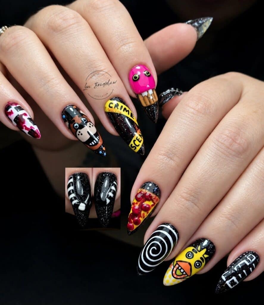 Hands displaying colourful Halloween-inspired stiletto nail art