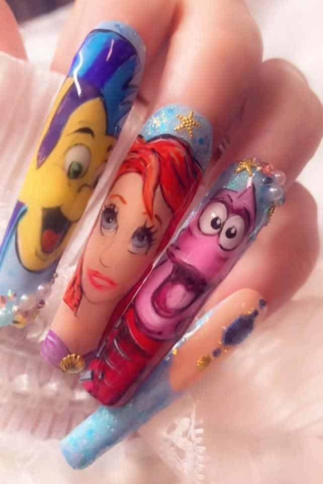 Disney Little Mermaid character nail art on long acrylic nails