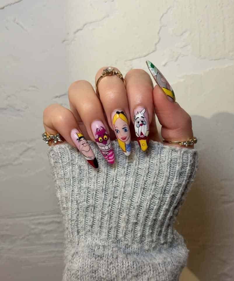 Hand with Alice in Wonderland character nail art