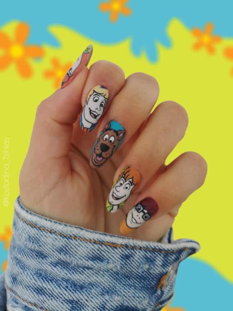 Hand with Scooby-Doo character nail art
