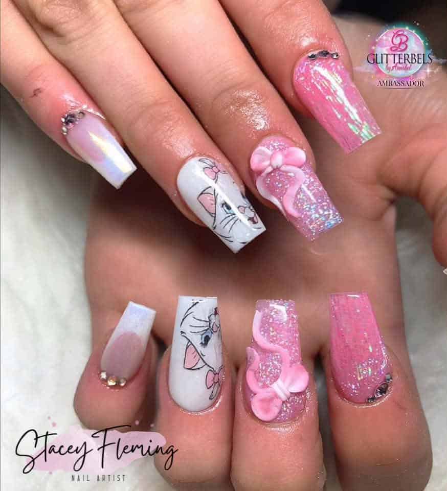 Pink glitter acrylic nails with cartoon character art
