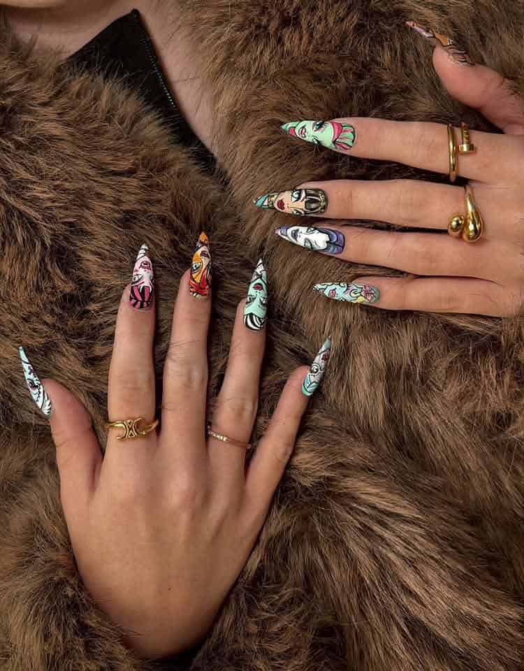 Hands with illustrated nail art on faux fur coat