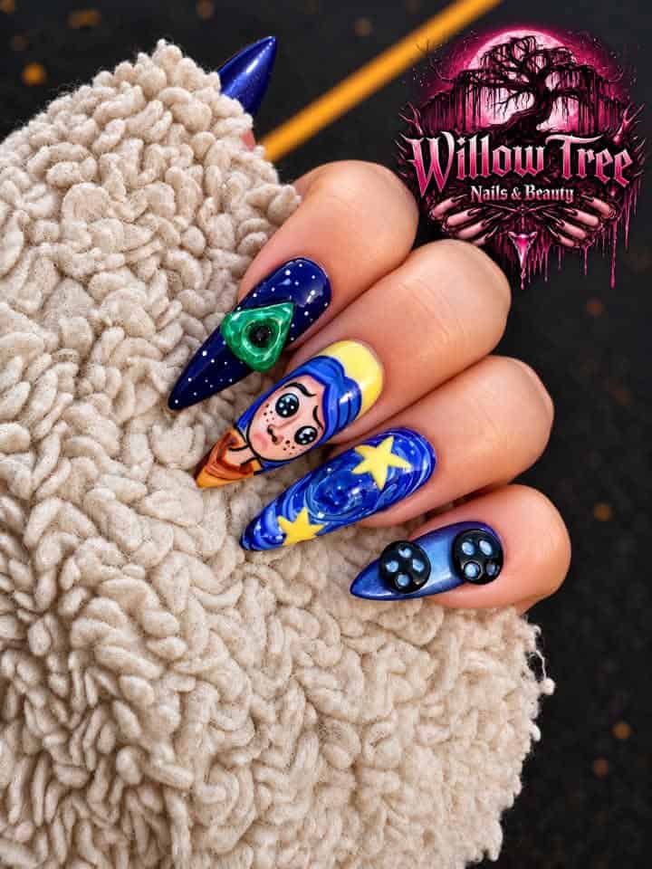 Cosmic-themed blue stiletto nail art with cartoon astronaut