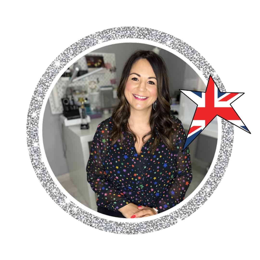 Smiling woman in star-patterned blouse with Union Jack star