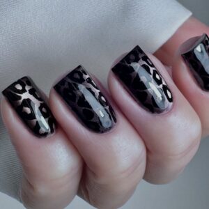 Glossy black and silver snake-patterned square nails