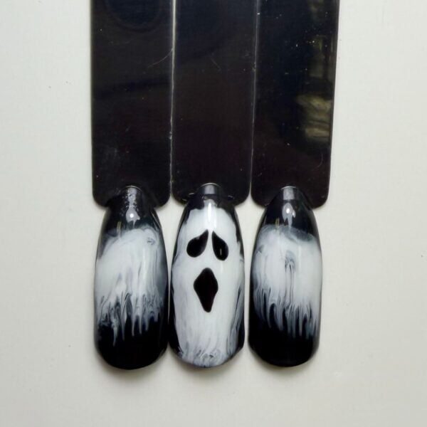 Three black and silver ghost-themed artificial nails