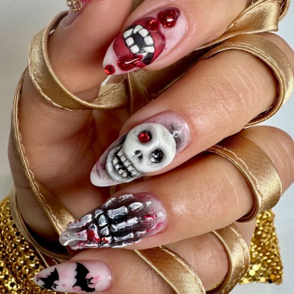 Halloween nail art with skull, teeth and blood details